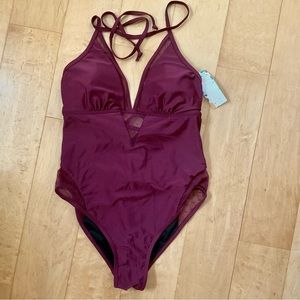 One piece swimsuit with mesh inserts